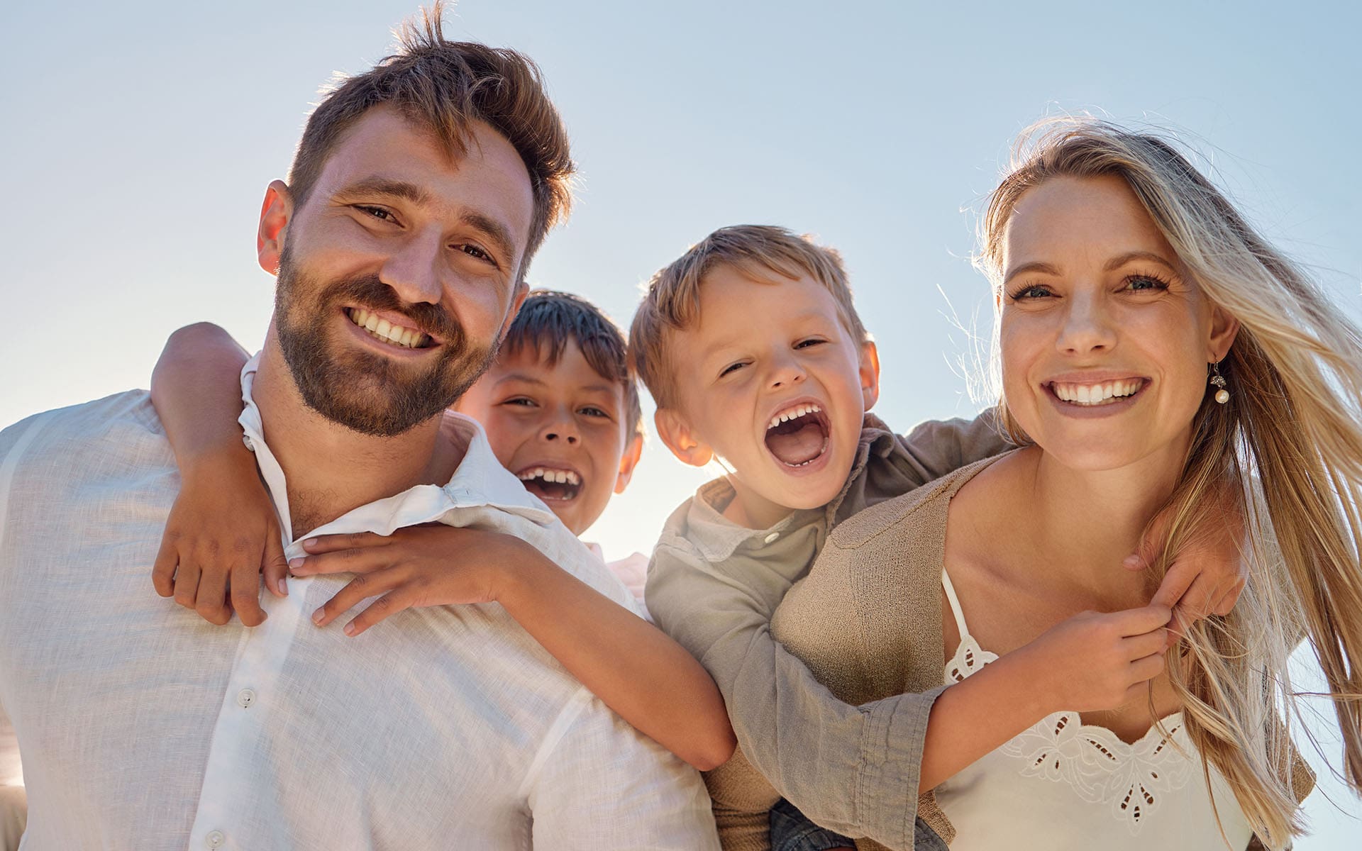 Burkhart-Presidio Insurance Agency - Cheerful Family Laughing Together